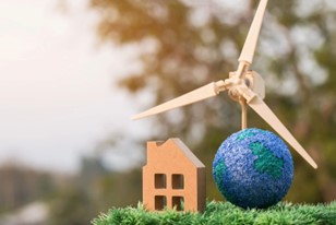 small house and earth in front of windmill